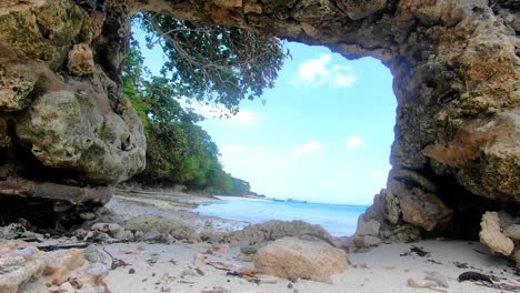 shiny view of a shoreline under the hole of the rock pile