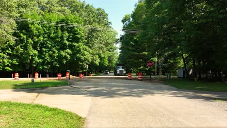 Warm-summer-day-with-a-car-approaching-and-then-turning