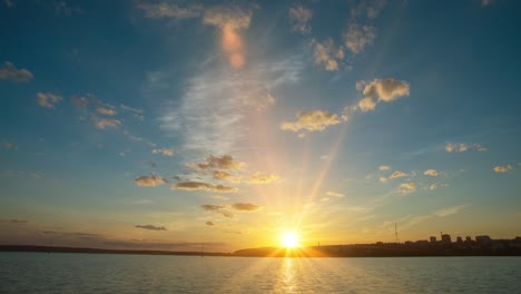 romantic colorful sunset on the sea. against the background of the sea, the sun sets, blue and orange clouds flow in the sky. majestic summer landscape. landscape sunset time lapse, video loop