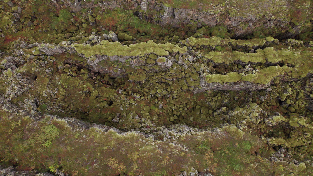 Top down dolly left of Hrafnagja Basalt canyon in central Iceland, tectonic plates meeting, fault line