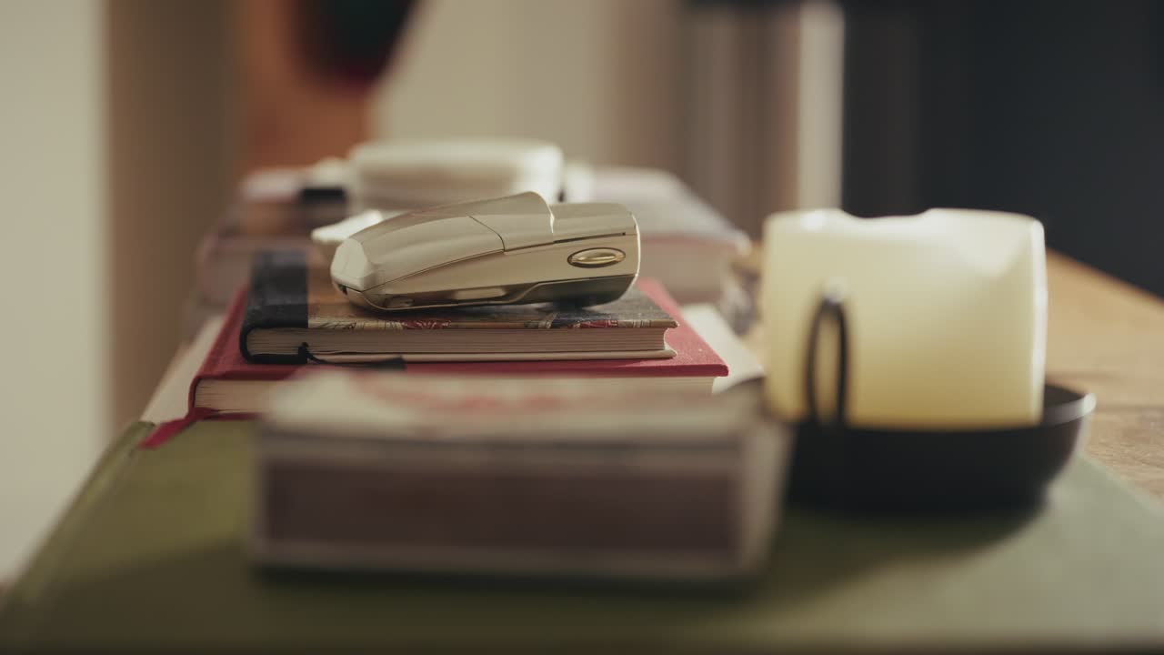 A person takes an old phone and departs, calm and nostalgic atmosphere