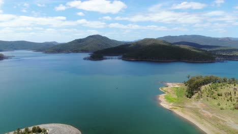 slow pan, expansive panorama of advancetown lake on a clear summers day
