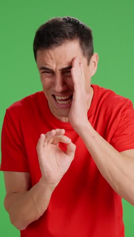 man playing a joke on someone, on green screen background