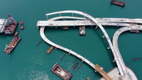 Hong-Kong-cross-bay-link-construction-project,-a-dual-two-lane-bridge-connecting-Tseung-Kwan-O-Lam-Tin-Tunnel-to-Wan-Po-Road,-Aerial-view