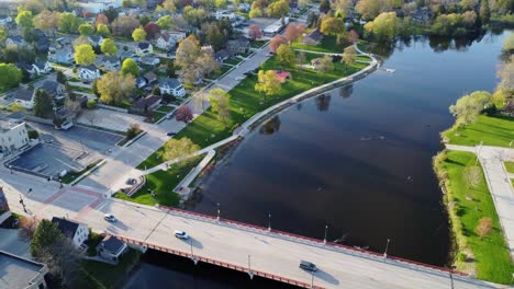 aerial flyover of a bridge in a suburban downtown