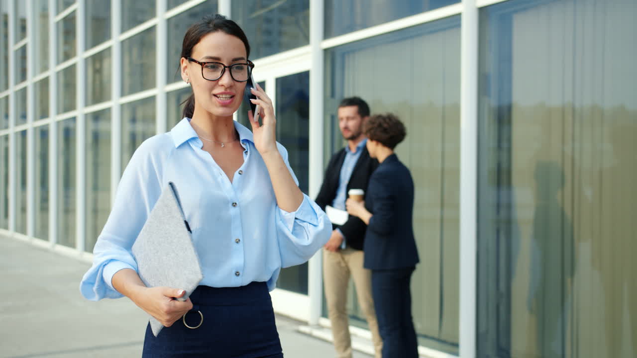 Business Woman on Phone Outside Office Building