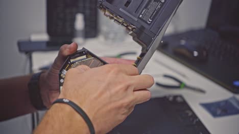 technician repairing broken circuit board on damaged dji drone