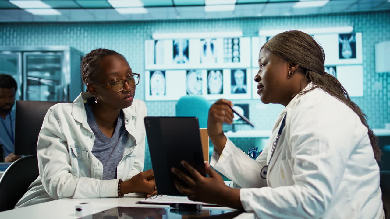 Black specialist providing checkup examination on insurance with patient