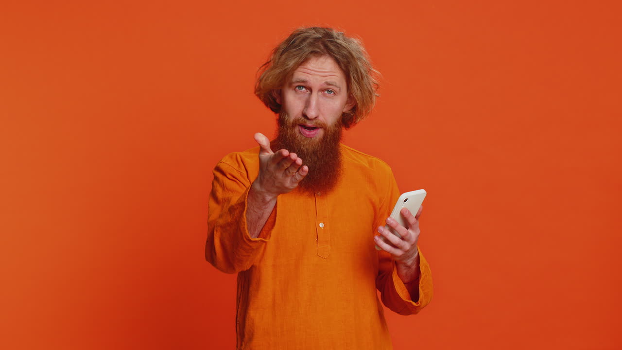 Man use smartphone typing new post on web browsing searching positive application game feedback