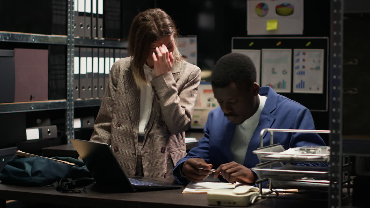 Two colleagues collaborating on a project in the office