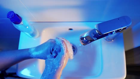woman use soap and washing hands under the water tap. hygiene. stop coronavirus