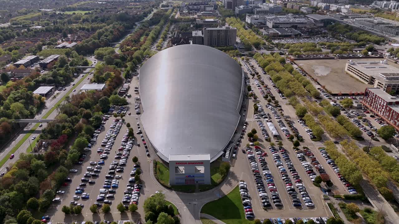 iFLY indoor skydiving aerial view towards futuristic sleek silver shopping centre and car park