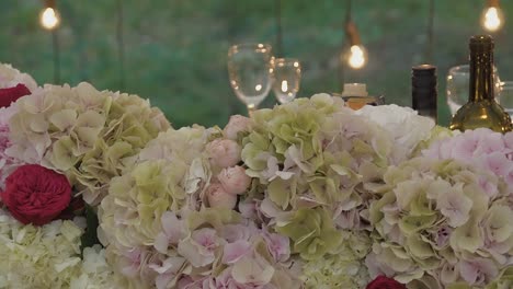 arch for the newlyweds is decorated with flowers