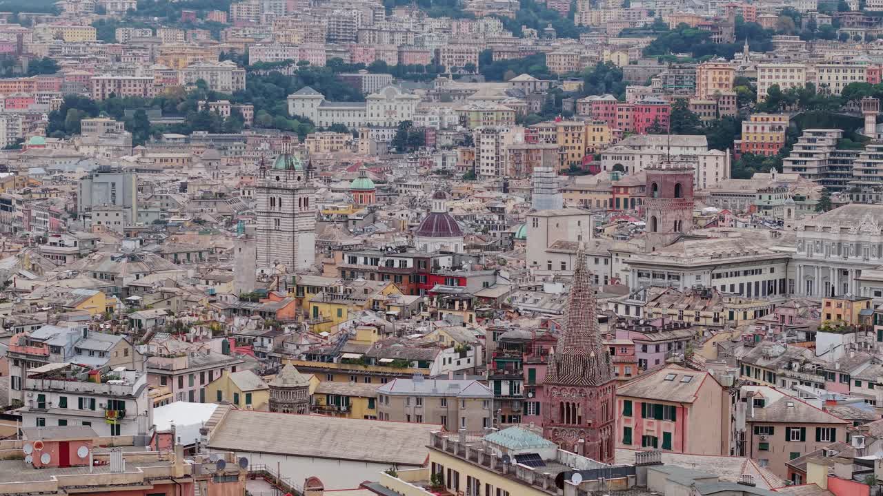 Genoa cityscape with colorful buildings, historic architecture, and distant rolling hills