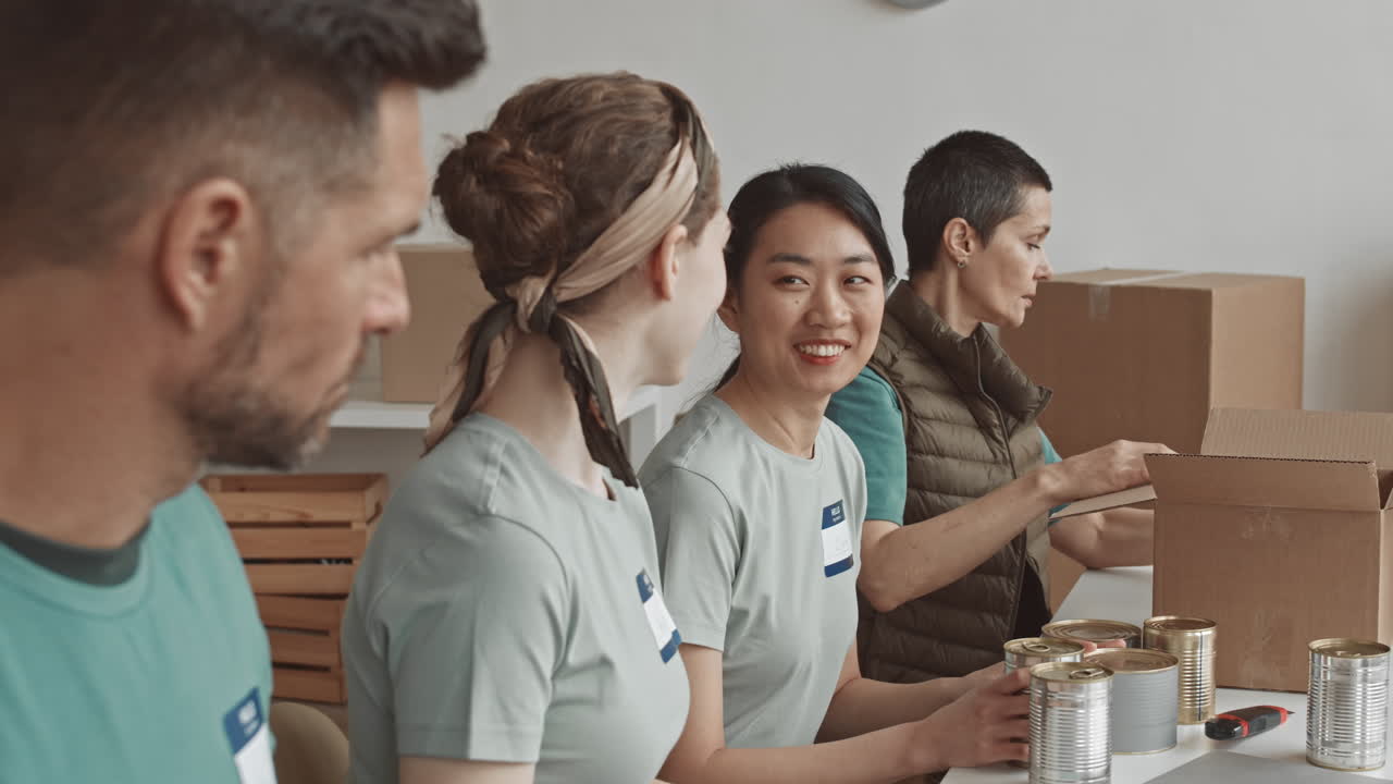 Volunteers packing food boxes