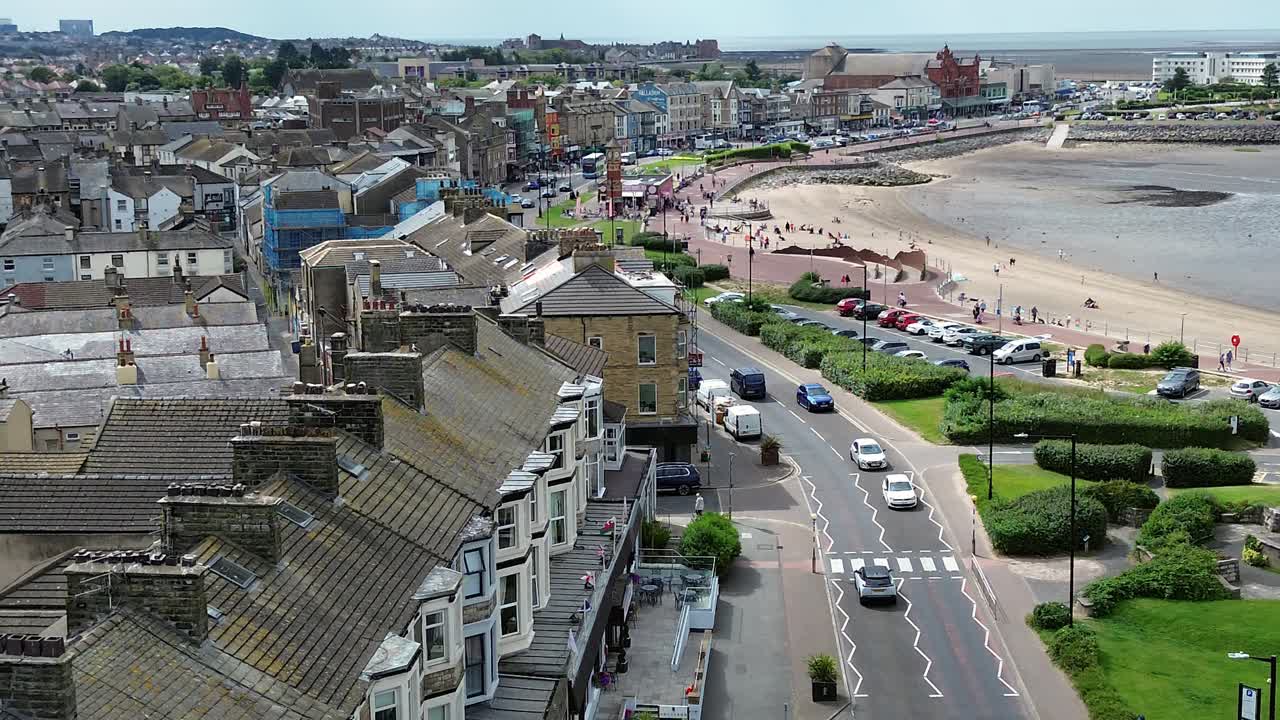 Morecambe town hotels rooftops aerial view overlooking busy sunny seaside promenade street