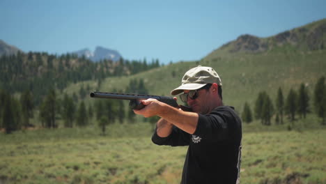 outdoorsman aims pump action shotgun, fails to fire, checks weapon, walks away, slowmo