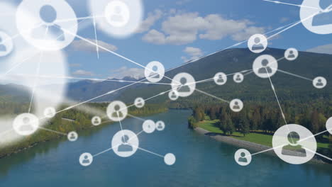 animation of network of connections with icons over mountain landscape