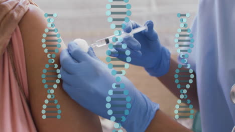 animation of dna strands over biracial woman being vaccinated