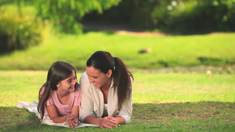 mother and daughter chatting outdoors