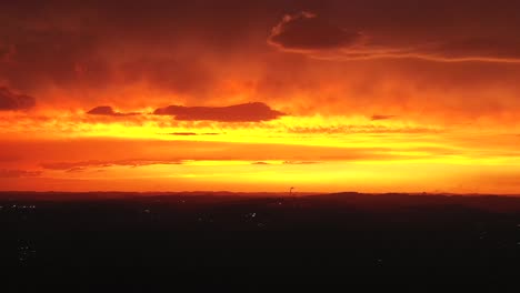 aerial drone shot of a stunning fiery red and orange sky