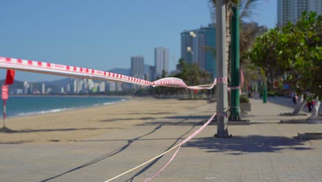 corona virus threat closes beaches and public places in many countries. the inscription not allowed area in english, chinese and vietnamese