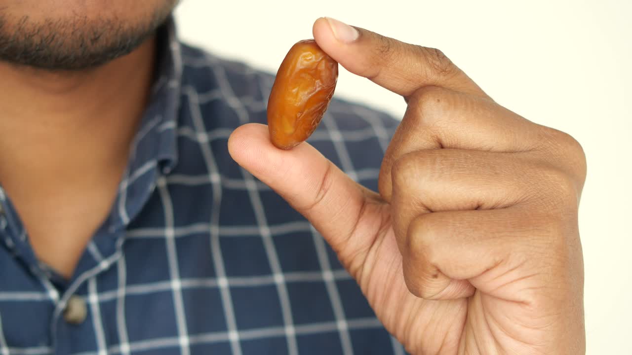 Person holding a date