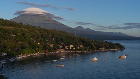 sunrise over a volcanic bay in bali