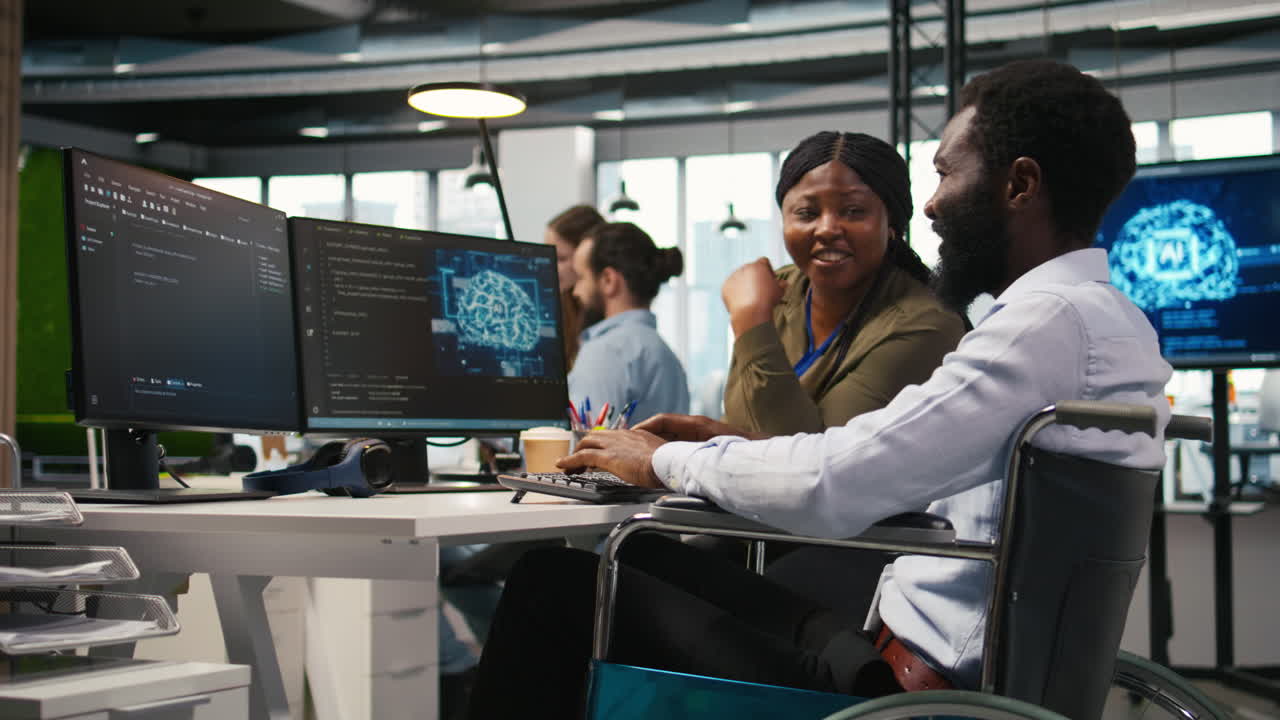 Joyous Technician With Disability And Coworker Chatting While Coding Ai