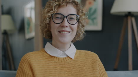 woman smiling on a couch