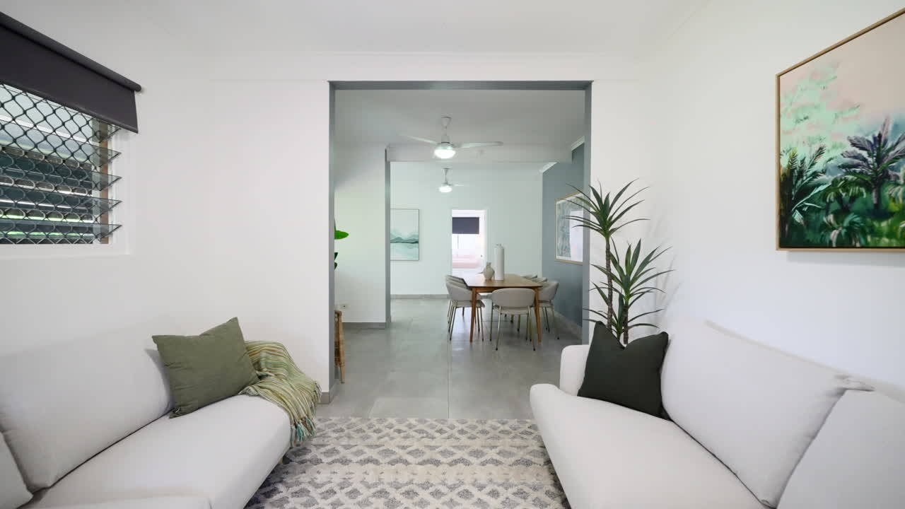 Minimalistic Modern Luxury Lounge Room with dual couches facing each other. Interior of house home for real estate property.
