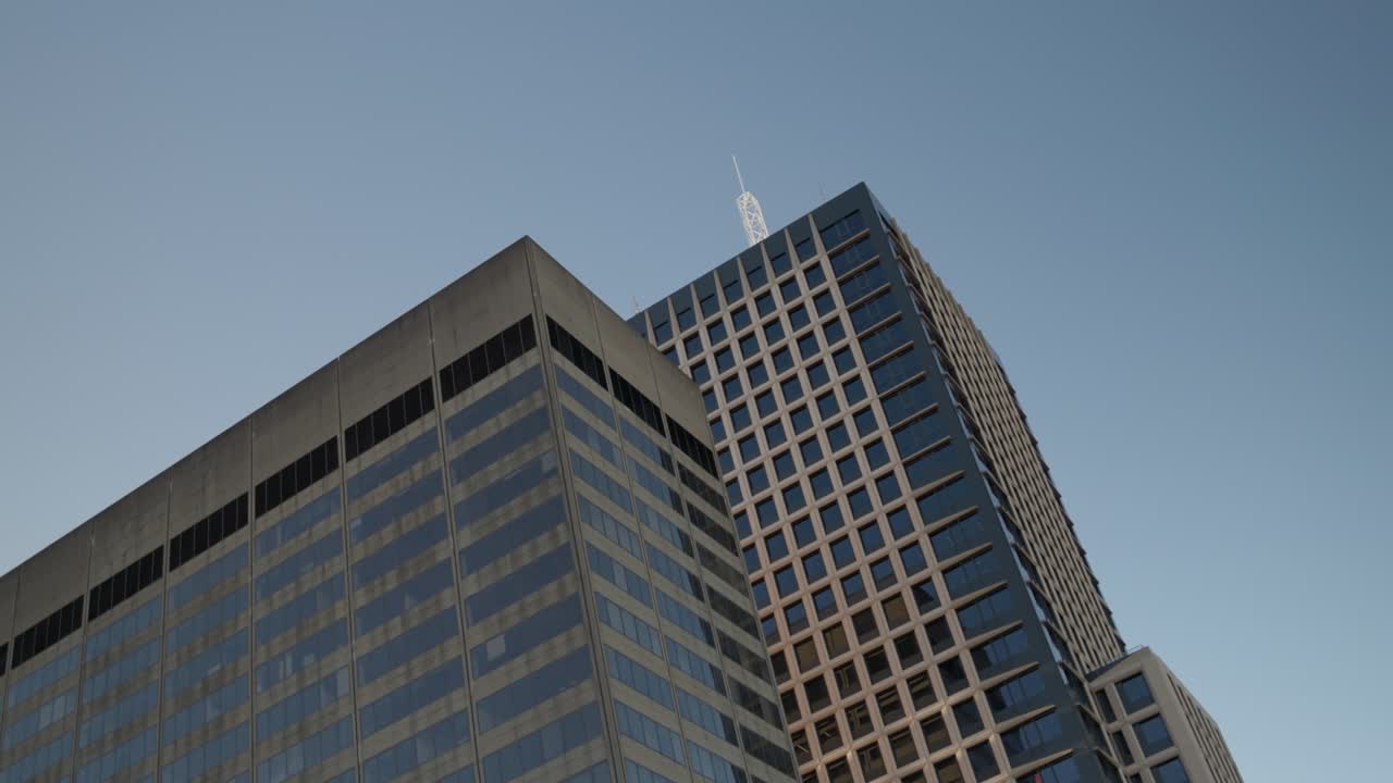 Sleek glass office towers reflecting the afternoon light in Sydney’s CBD