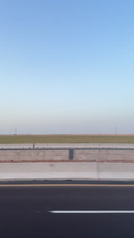 a view of a high way from a car, trucking shot