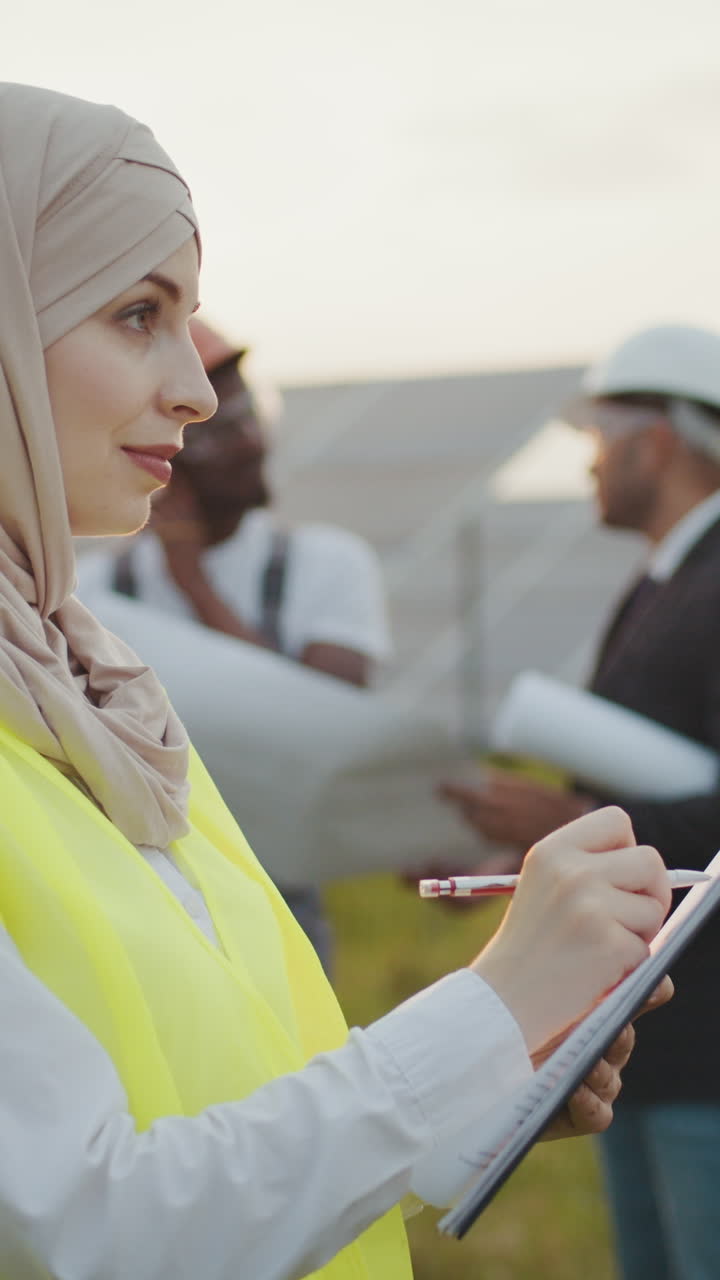 Architect writing on a clipboard