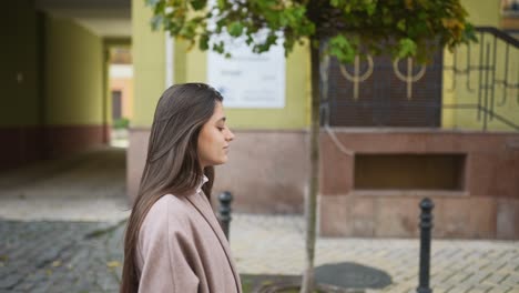 woman walking down a city street