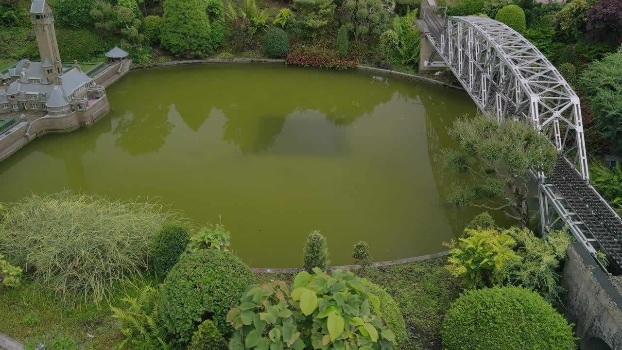 Drone like high angle aerial flying footage video of European Dutch city in Netherlands, Europe with water, bridge and traditional authentic architecture building on a daytime