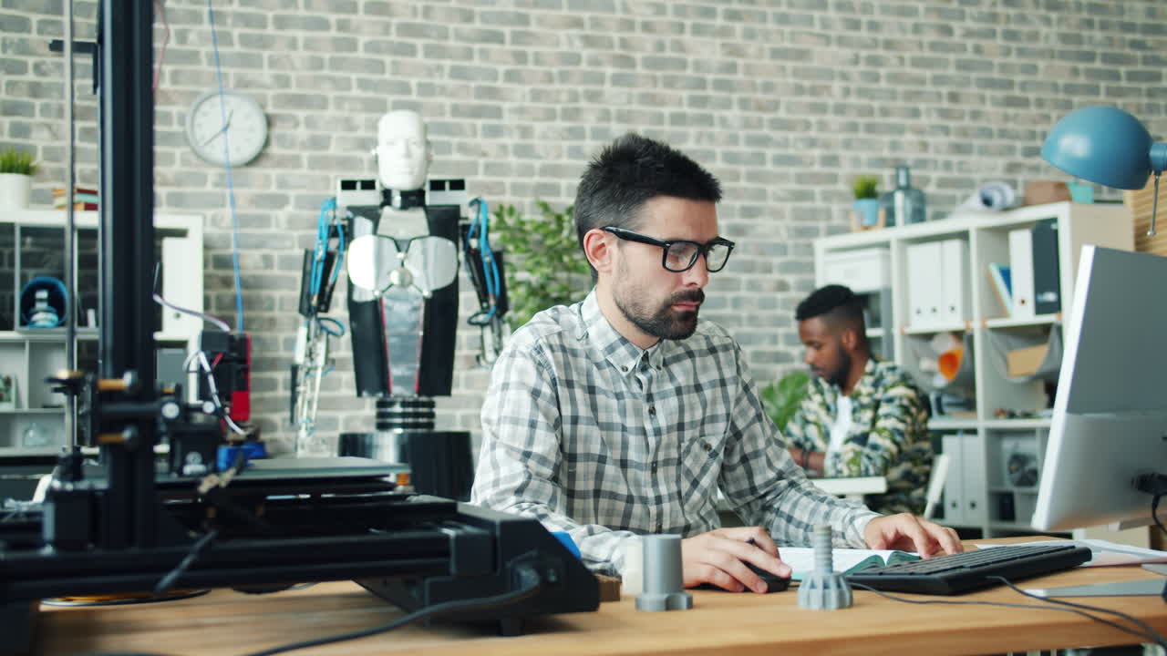 Engineer Working on 3D Printing and Robotics Project