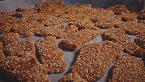 Close-up-view-of-chicken-nuggets-on-parchment-pape