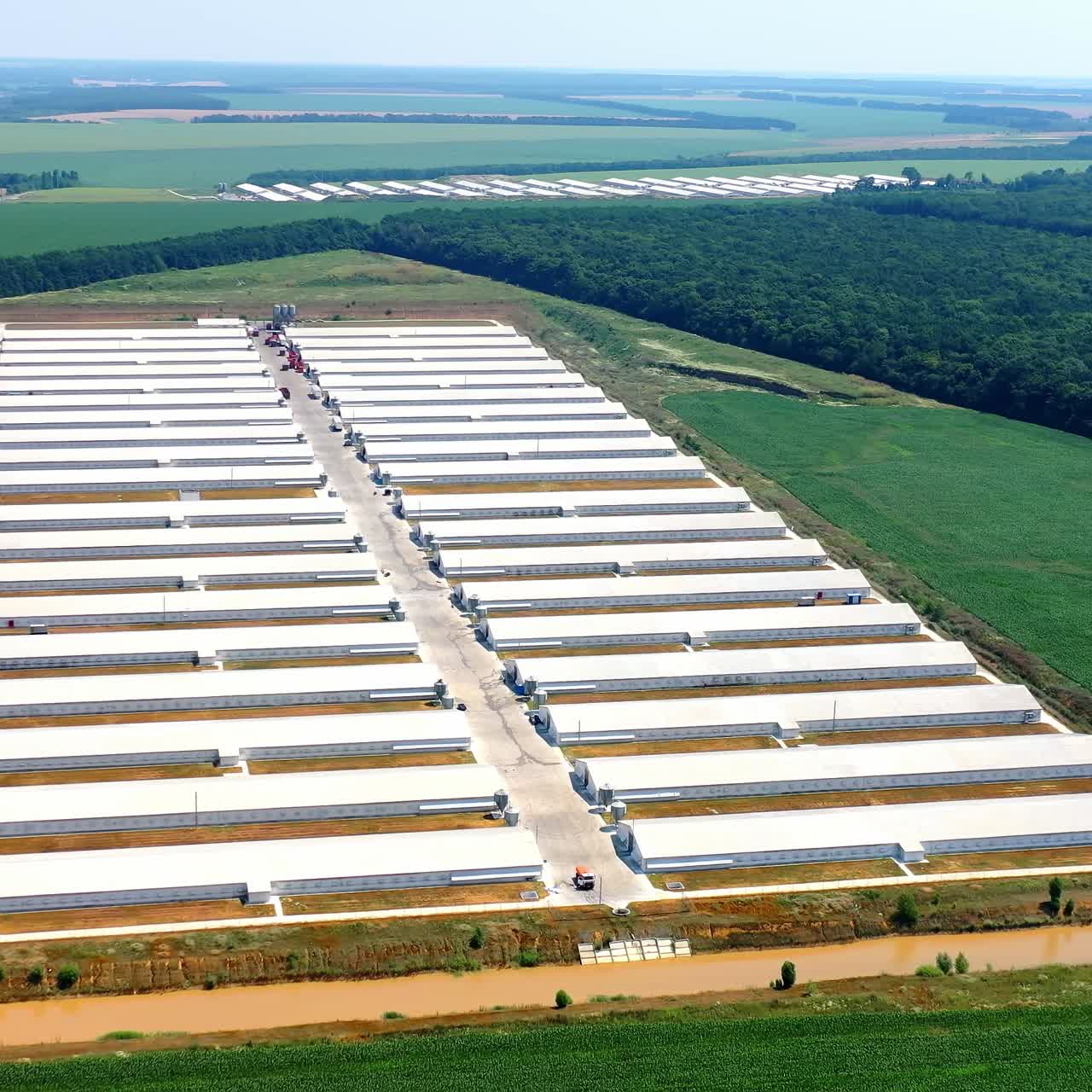 Modern agriculture plant fields farm buildings. Agricultural farming buildings aerial view