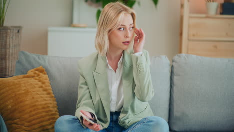 Sad-Broken-Girl-Reads-Bad-News-on-Smartphone