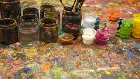 art supplies and paint splatters