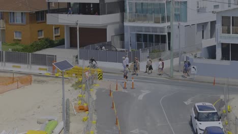 people walking near construction site