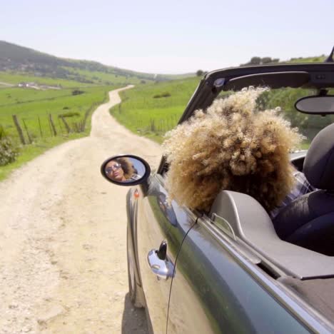 Woman-Drives-Along-An-Empty-Road