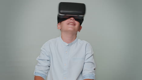 Toddler-boy-in-headset-helmet-app-to-play-simulation-realistic-game,-watching-virtual-reality-video