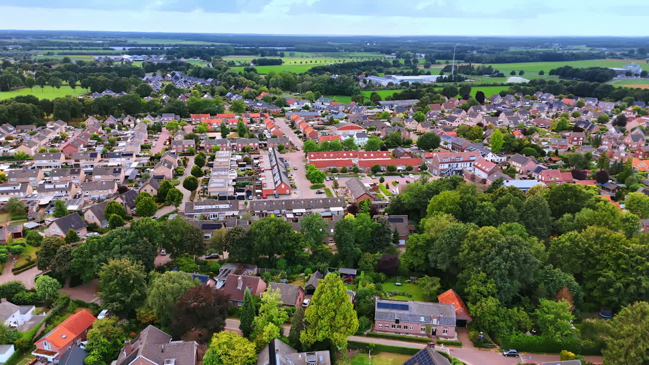 Serene suburban aerial view. Wide view of a serene neighborhood with houses, green spaces, and clean streets under daylight