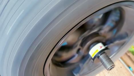 close-up of a spinning grey wheel