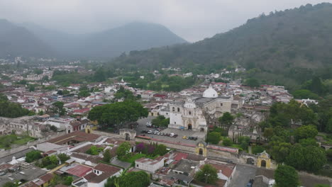 fast aerial flyover of a historical cathedral in the haze in antigua, guatemala