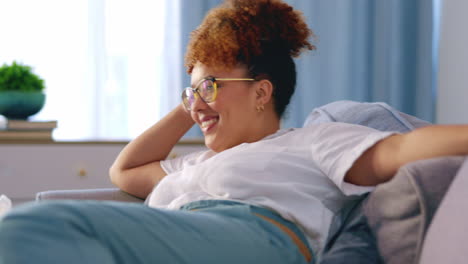 woman on couch, watching tv