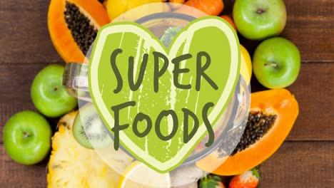 super foods text banner against various fruits on wooden surface