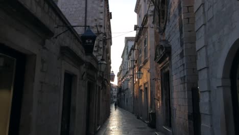 moving through an ally in old town dubrovnik at sunrise